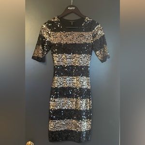 Black and gold sequin dress